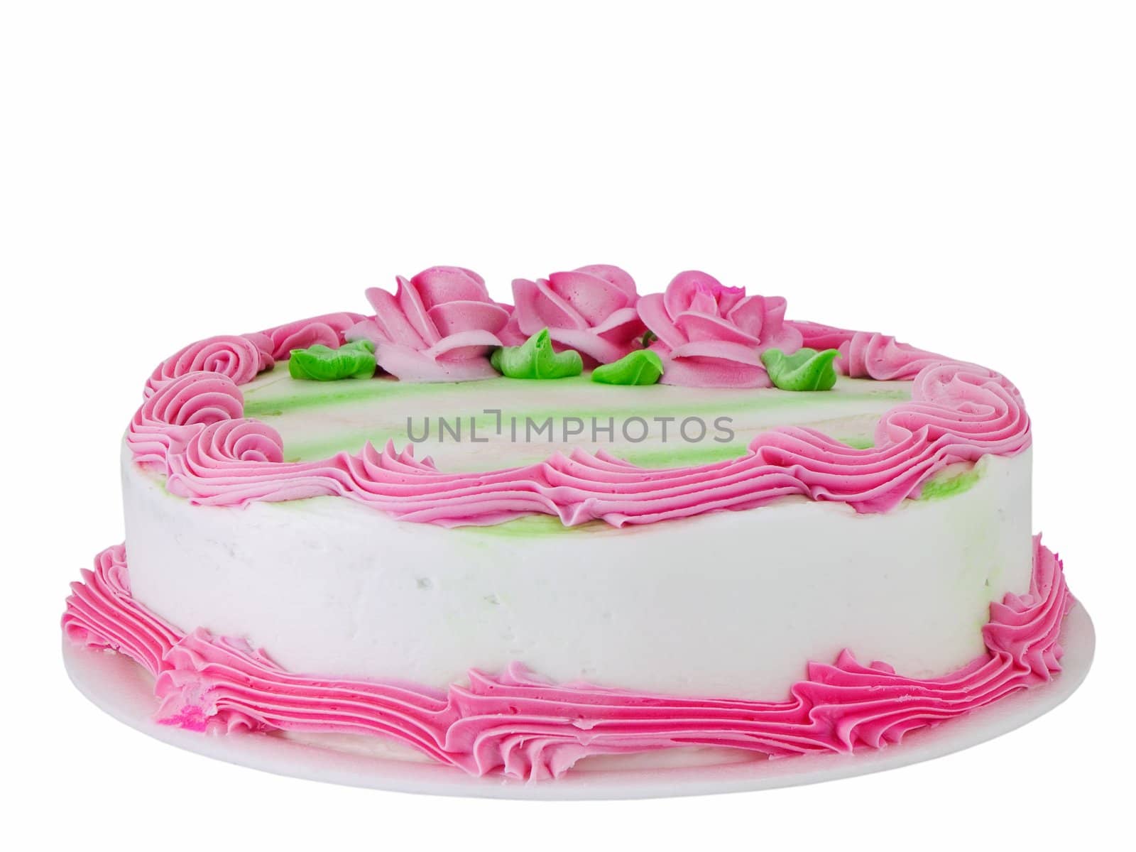 Cake with pink frosting and flowers isolated on white