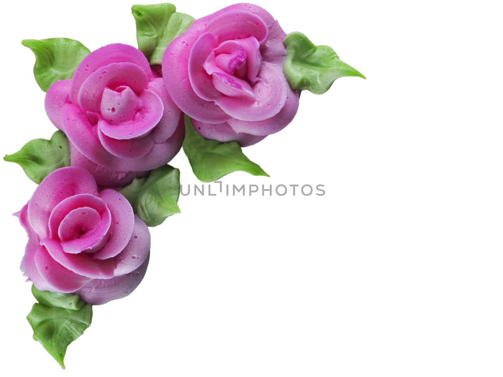 Roses created with frosting, isolated on white