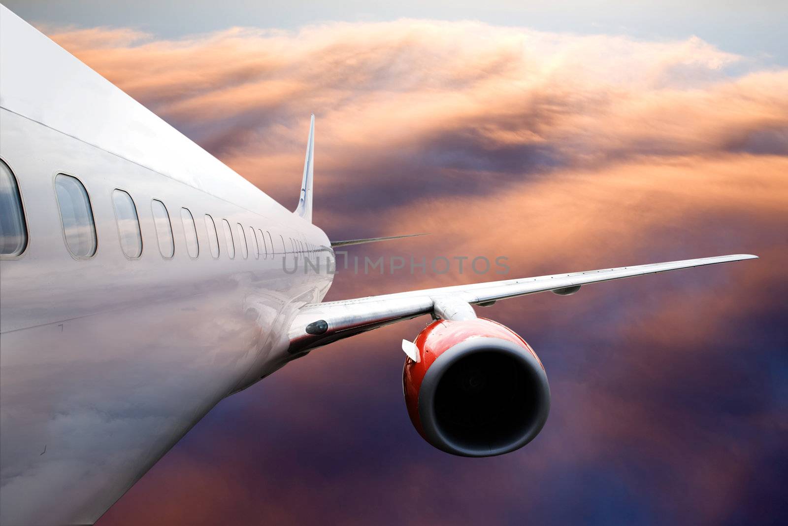 An airplane accending over a dramatic cloudscape.