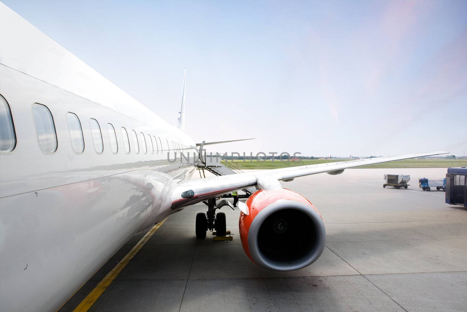 A airliner in an airport terminal;