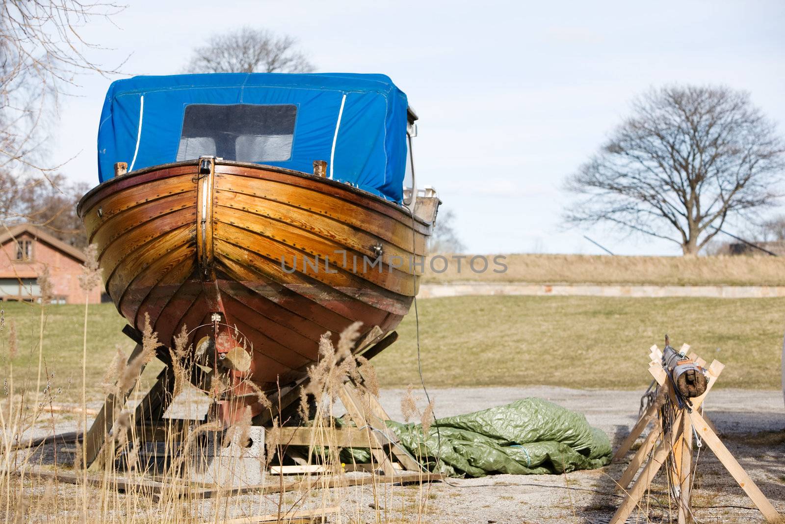 An old traditional Norwegian boat in the harbour for repair.