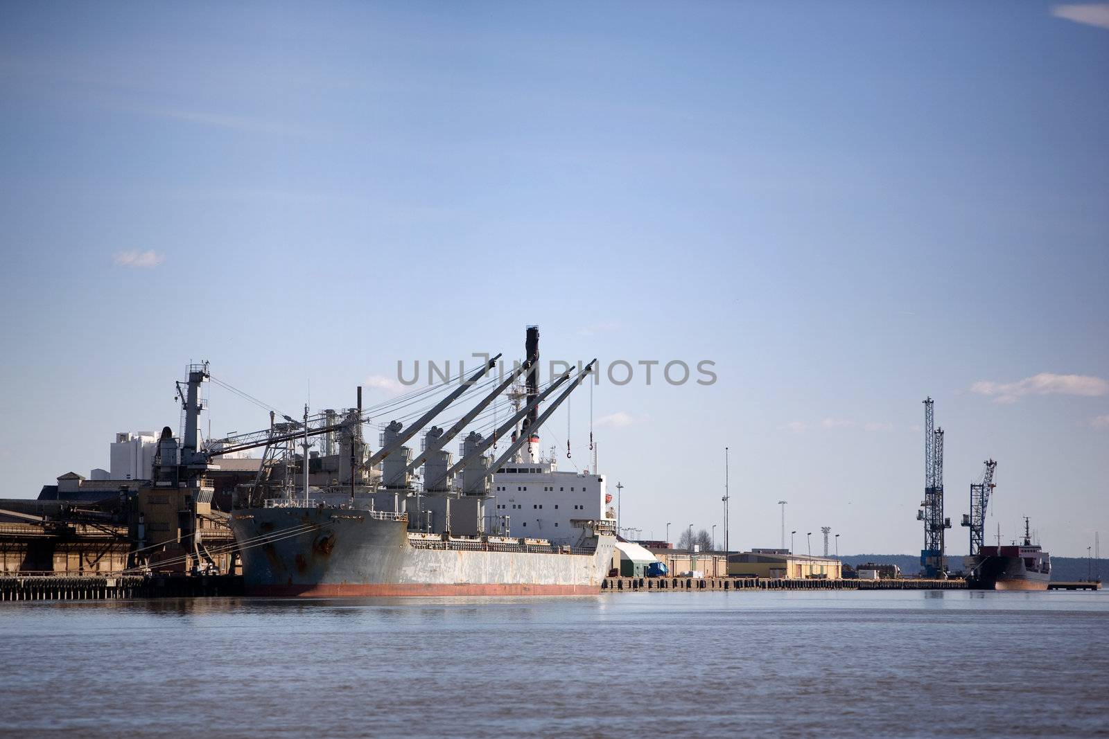 A large cargo ship in the harbour