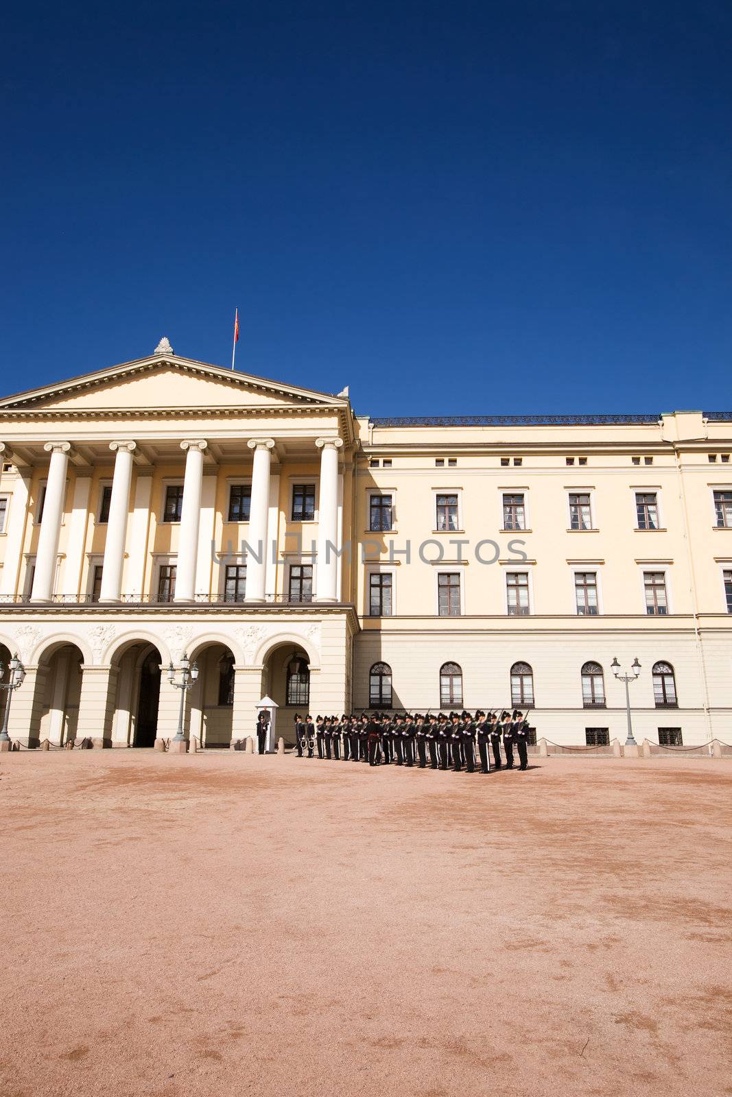 The Oslo Palace on a bright blue day waiting the arrival of a V.I.P.