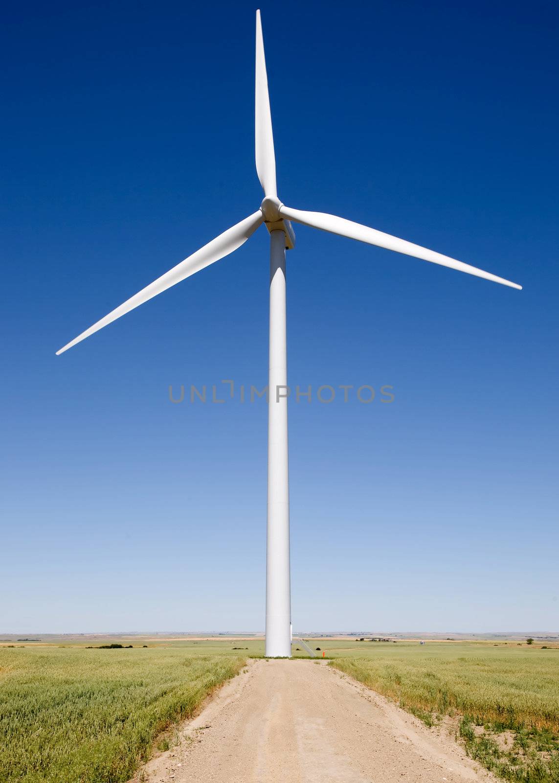A close up of a wind turbine on the flat prairie