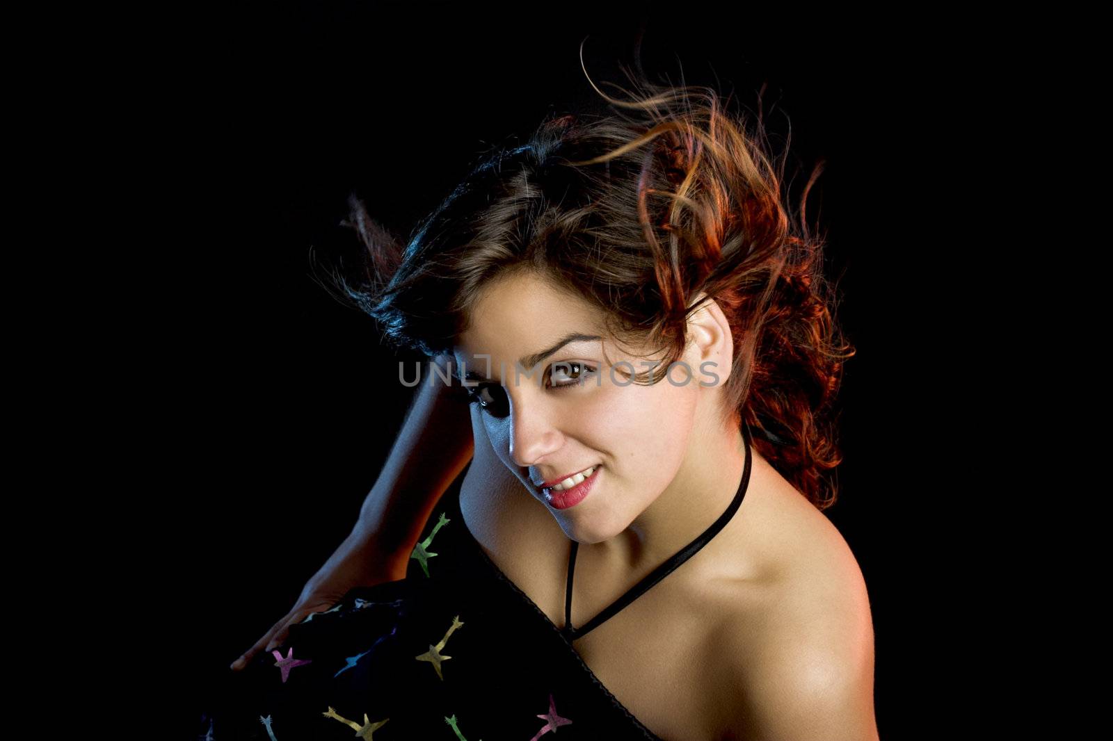 Portrait of a beautiful young and attractive woman on a black background