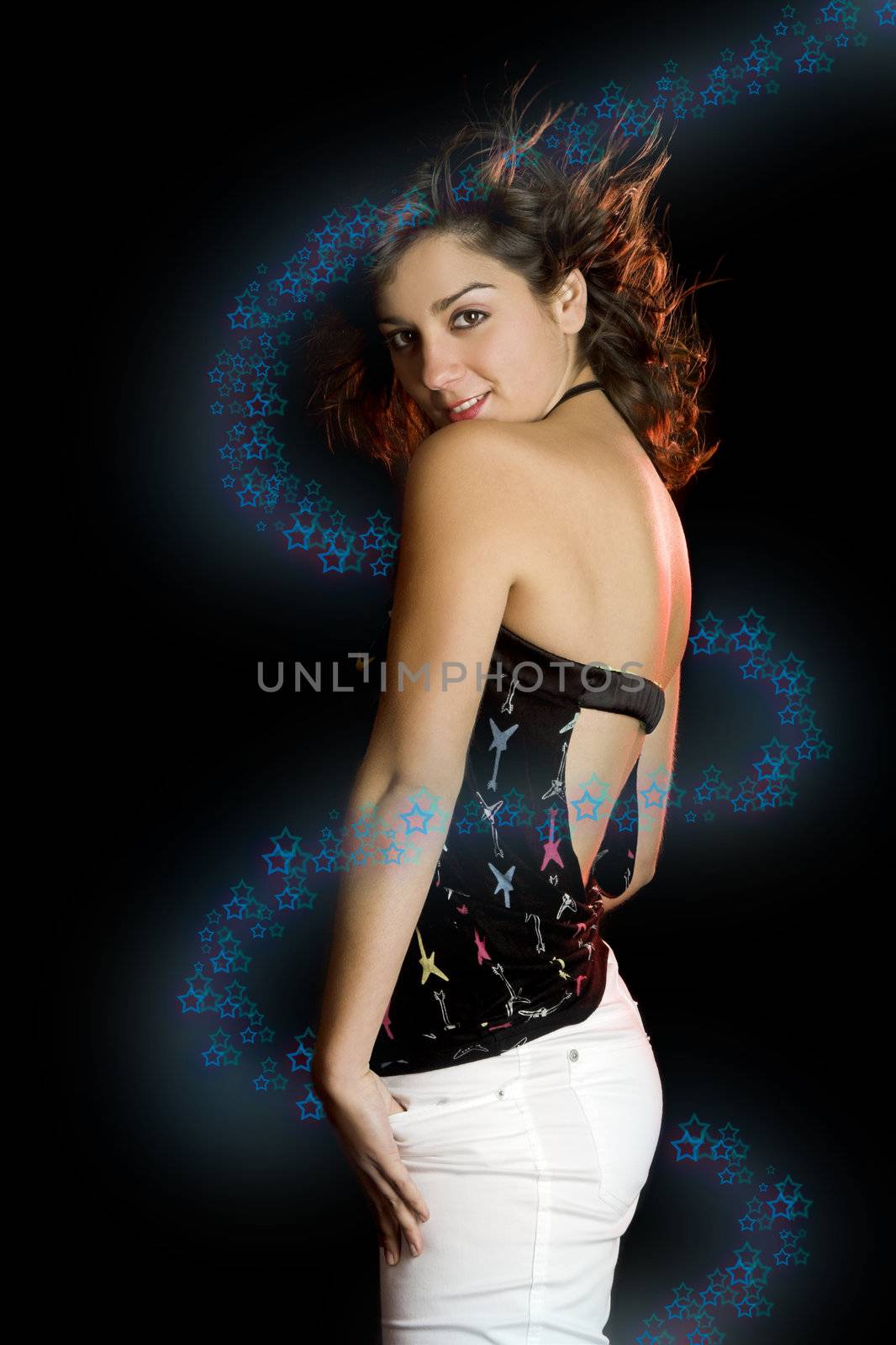 Portrait of a beautiful young and attractive woman on a black background - (Star effects surrounding the model)