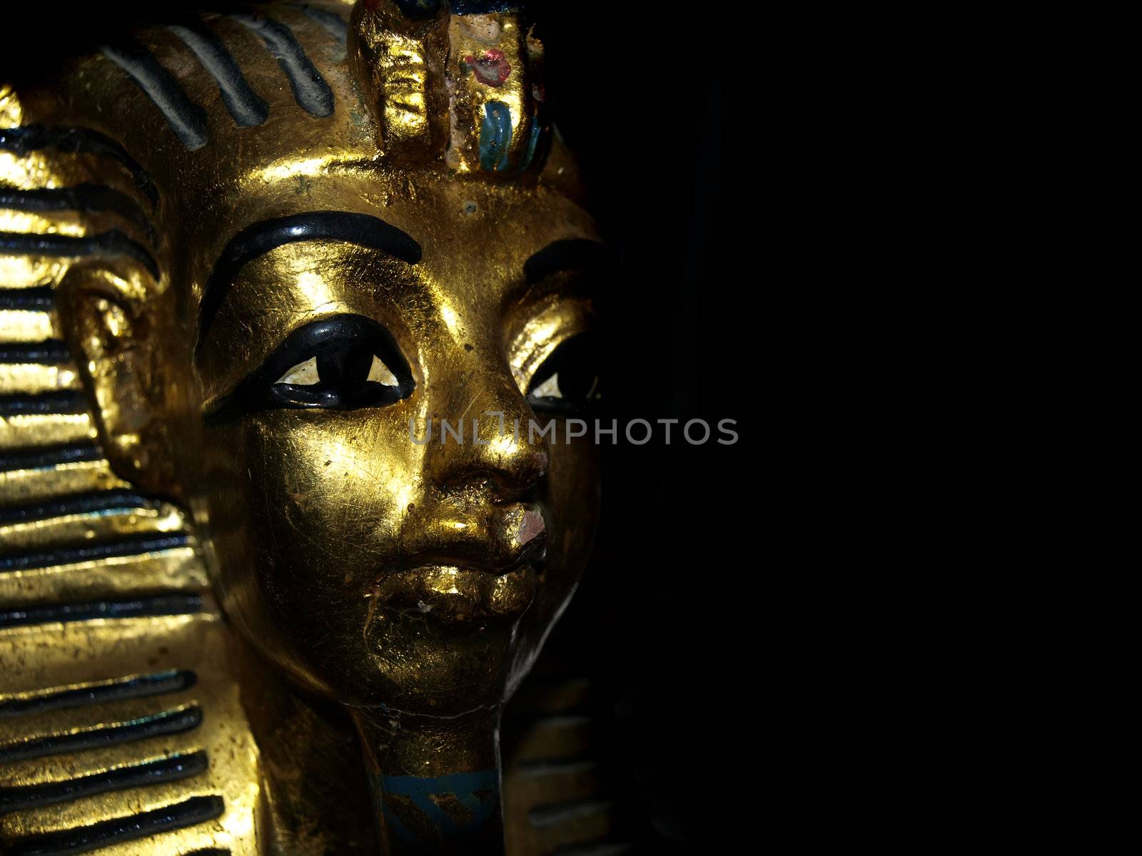 Gold mask motif of the ancient boy Pharaoh in Egypt