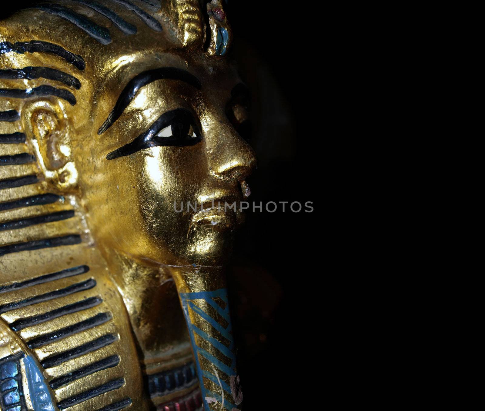 Gold mask motif of the ancient boy Pharaoh in Egypt