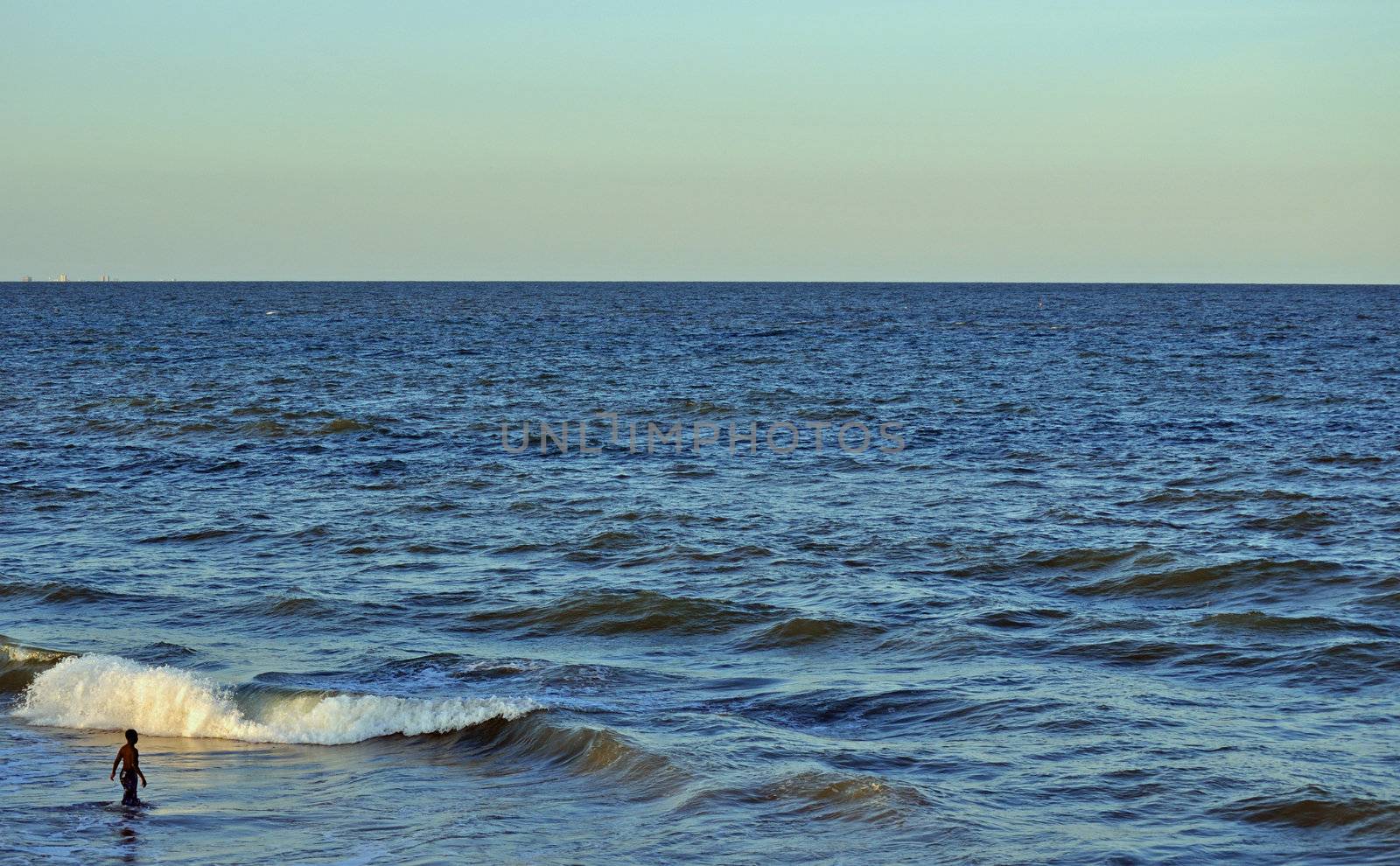 Man in the waves by RefocusPhoto