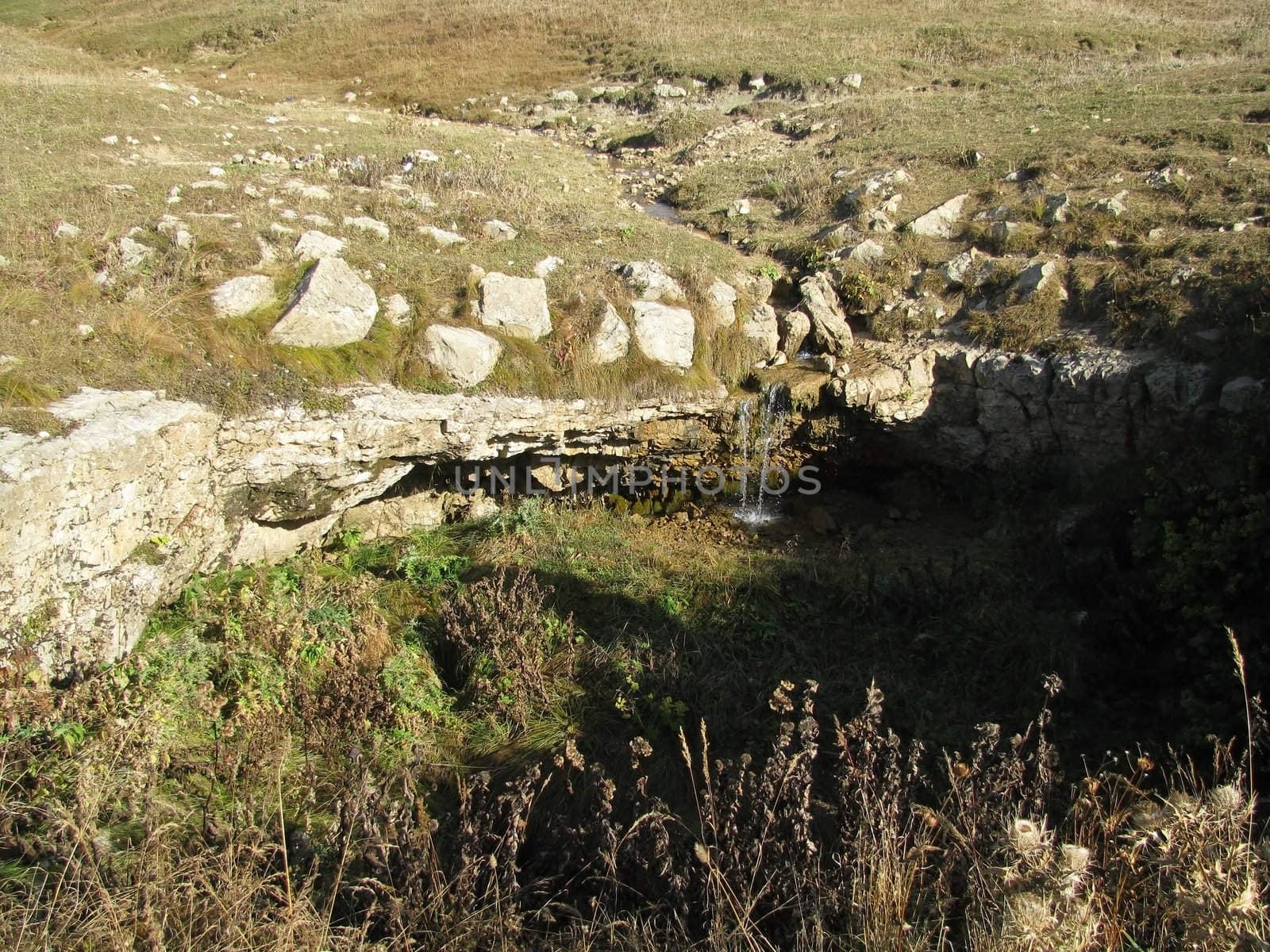 Greens; the Caucasian ridge; rocks; a relief; a landscape; a hill; a panorama; mountains; Caucasus; mountain; a slope