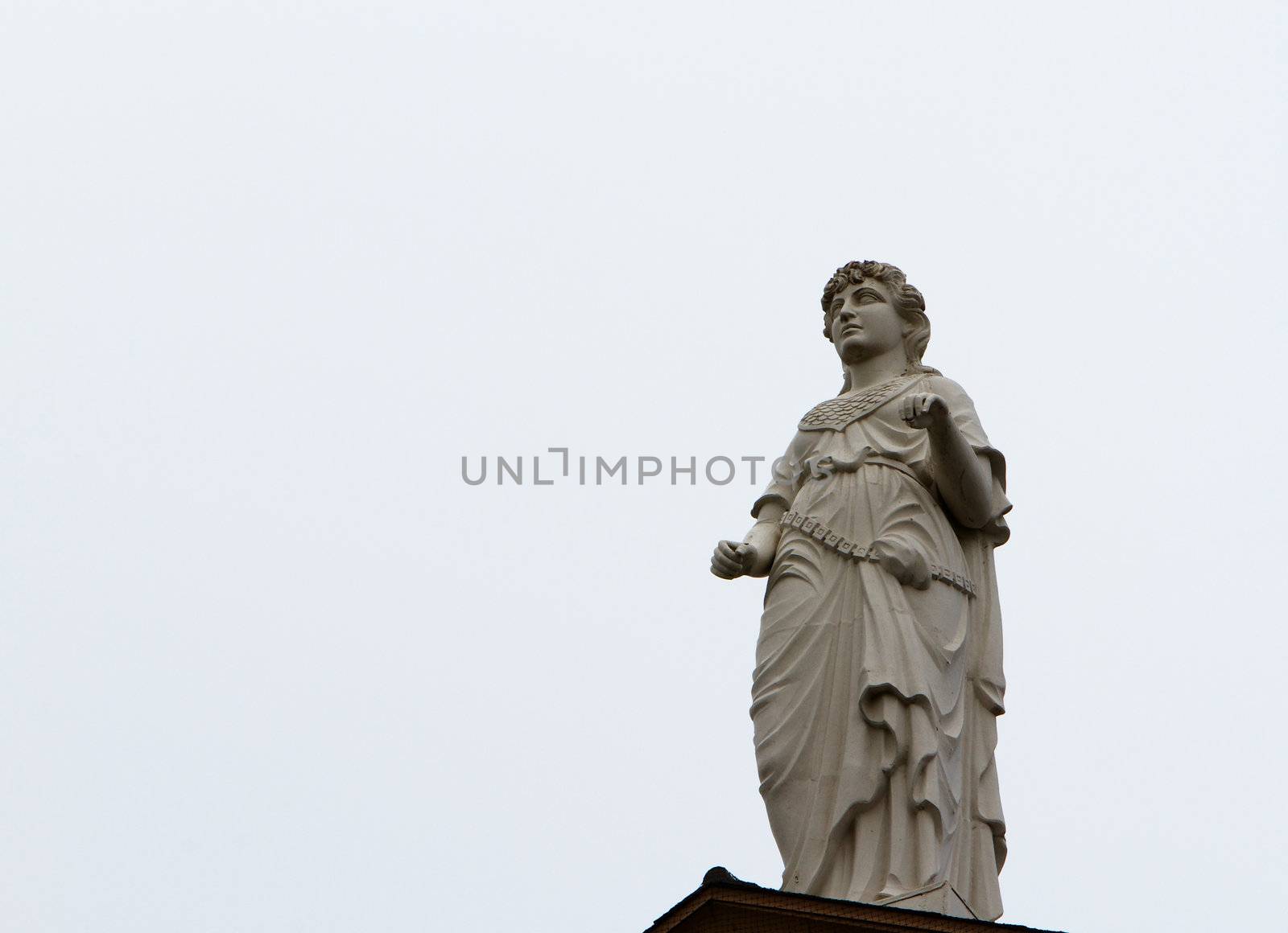 Courthouse statue of Themis Goddes of Justice missing sword and balance