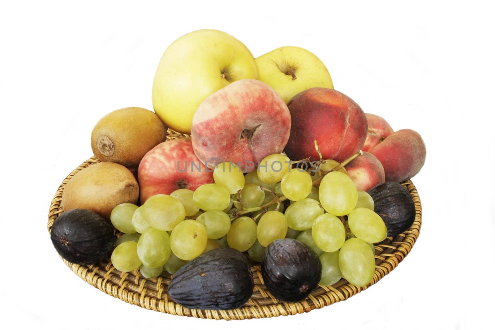  Fruits on wicked wooden plate in isolated over white