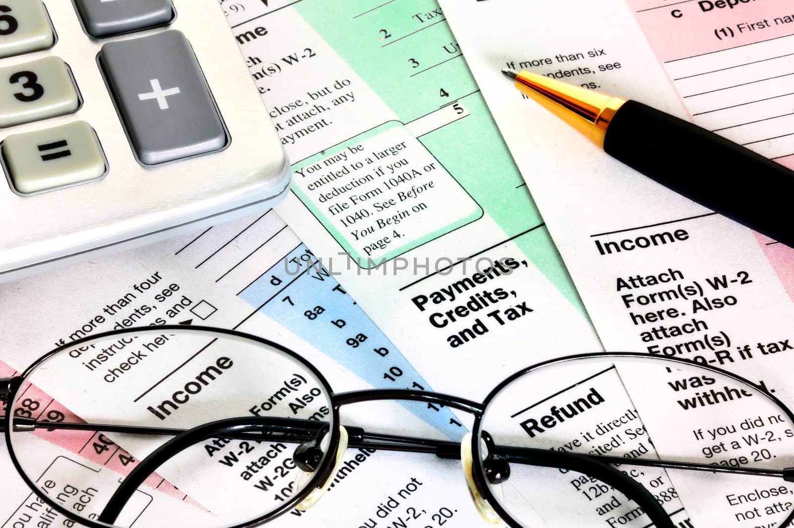 Business concept. Financial papers with calculator, glasses and pen.