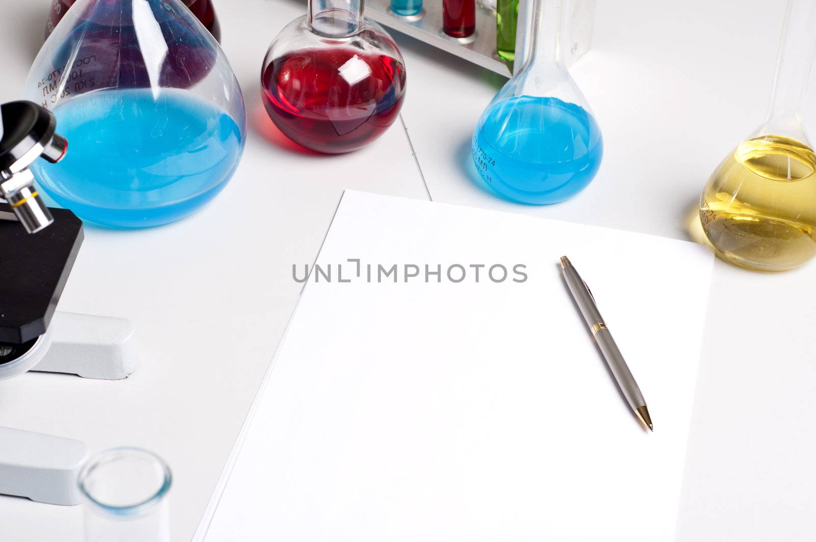 workplace employee lab,flasks with colored liquids, laboratory items