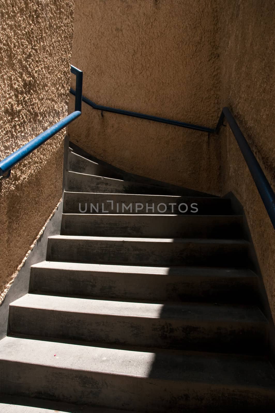 Stone ladder with a dark blue metal handrail