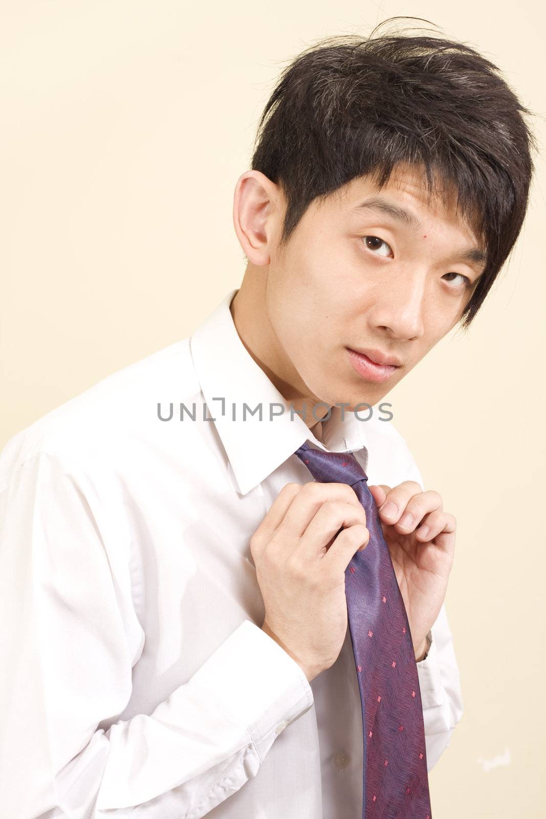 Young Asian man wearing suit