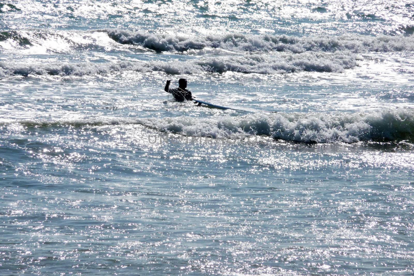 A man who is surfing off the Brighton Coast.