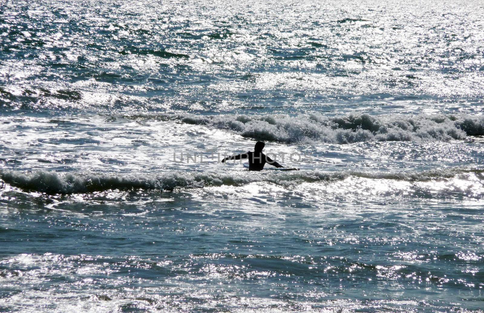 A man who is surfing off the Brighton Coast.