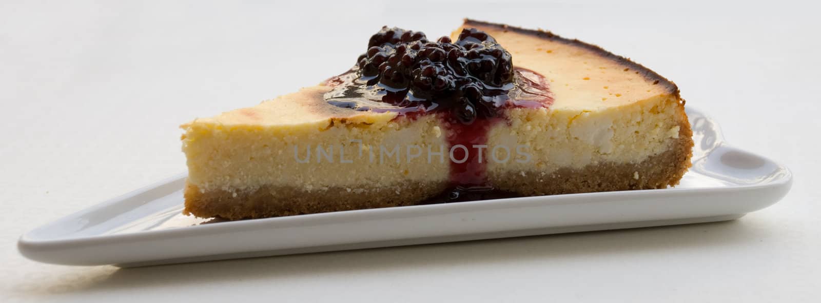 Baked cheesecake with blackberry sauce 