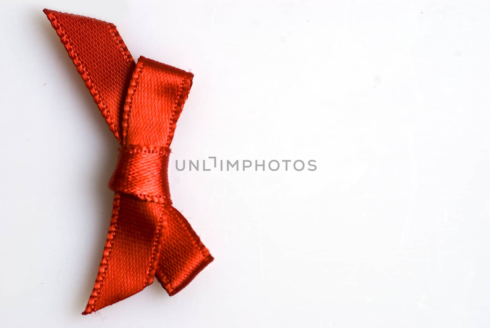 red ribbon tied in a bow