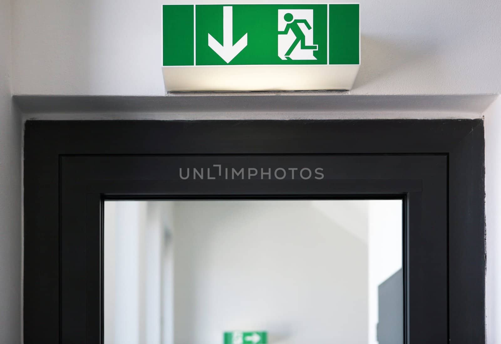 Door with table with exit sign above