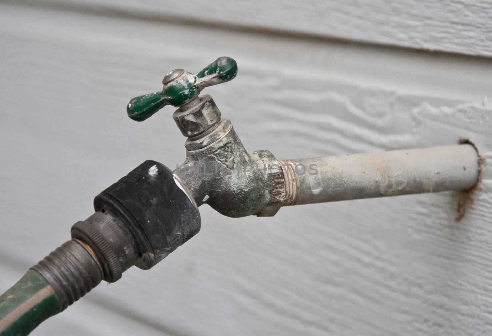 Weathered hose spout with spigot