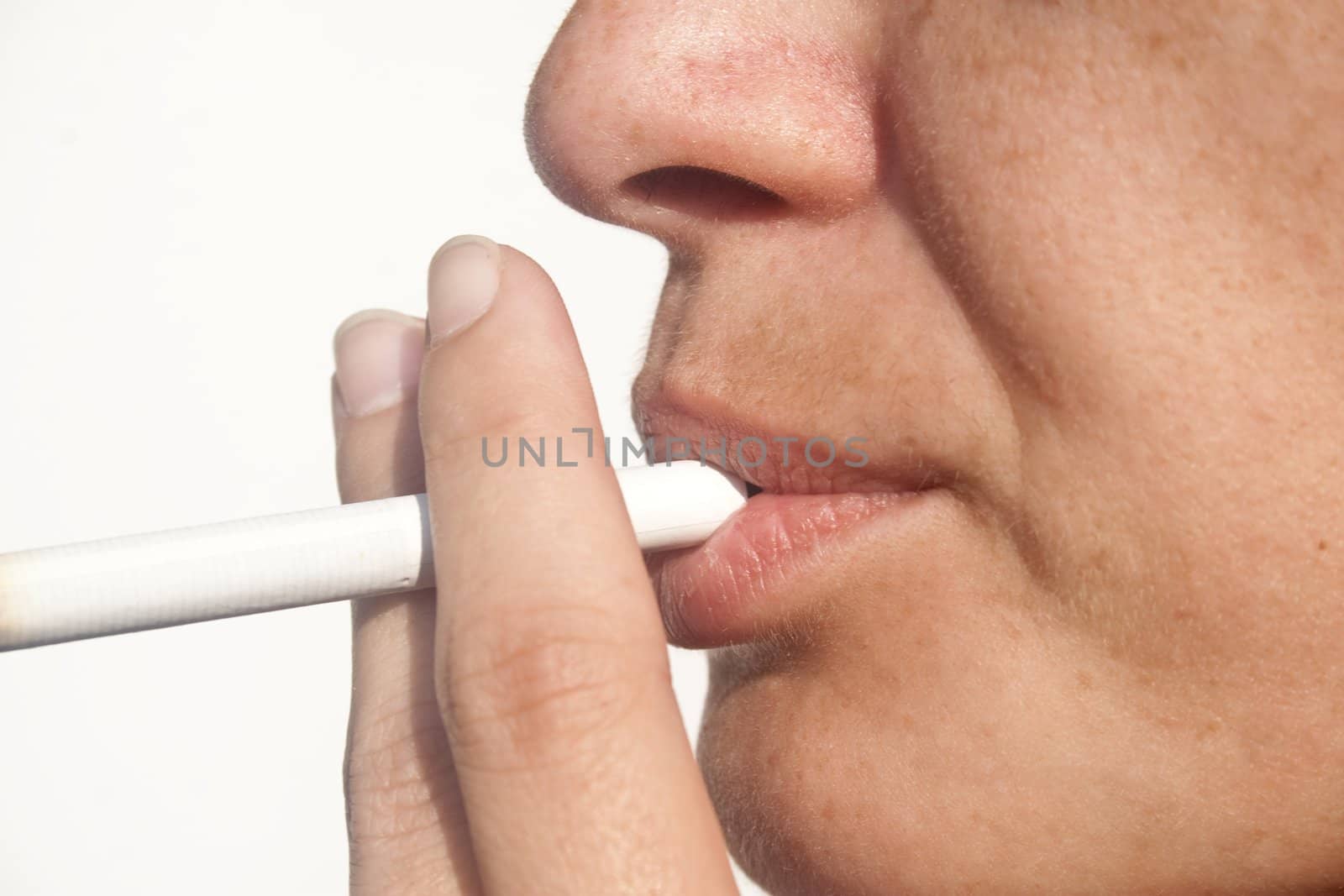 Closeup of lady with cigarette between lips