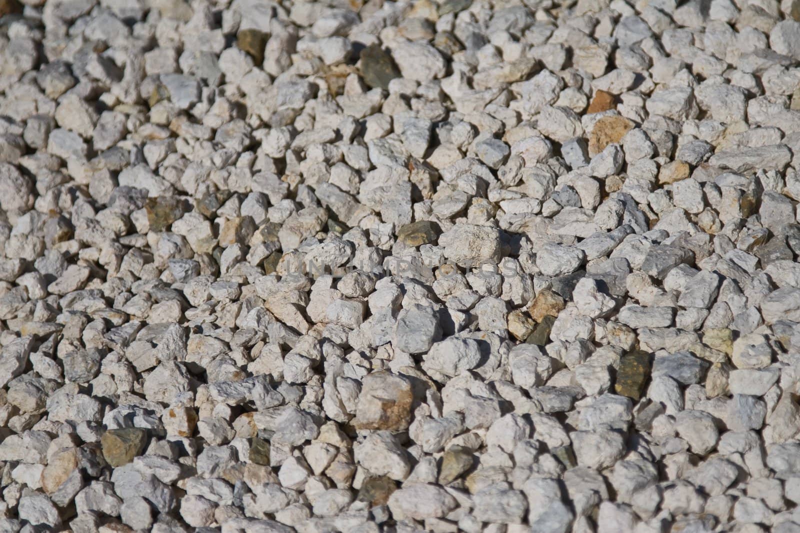 Ground covering of small rocks in different shades
