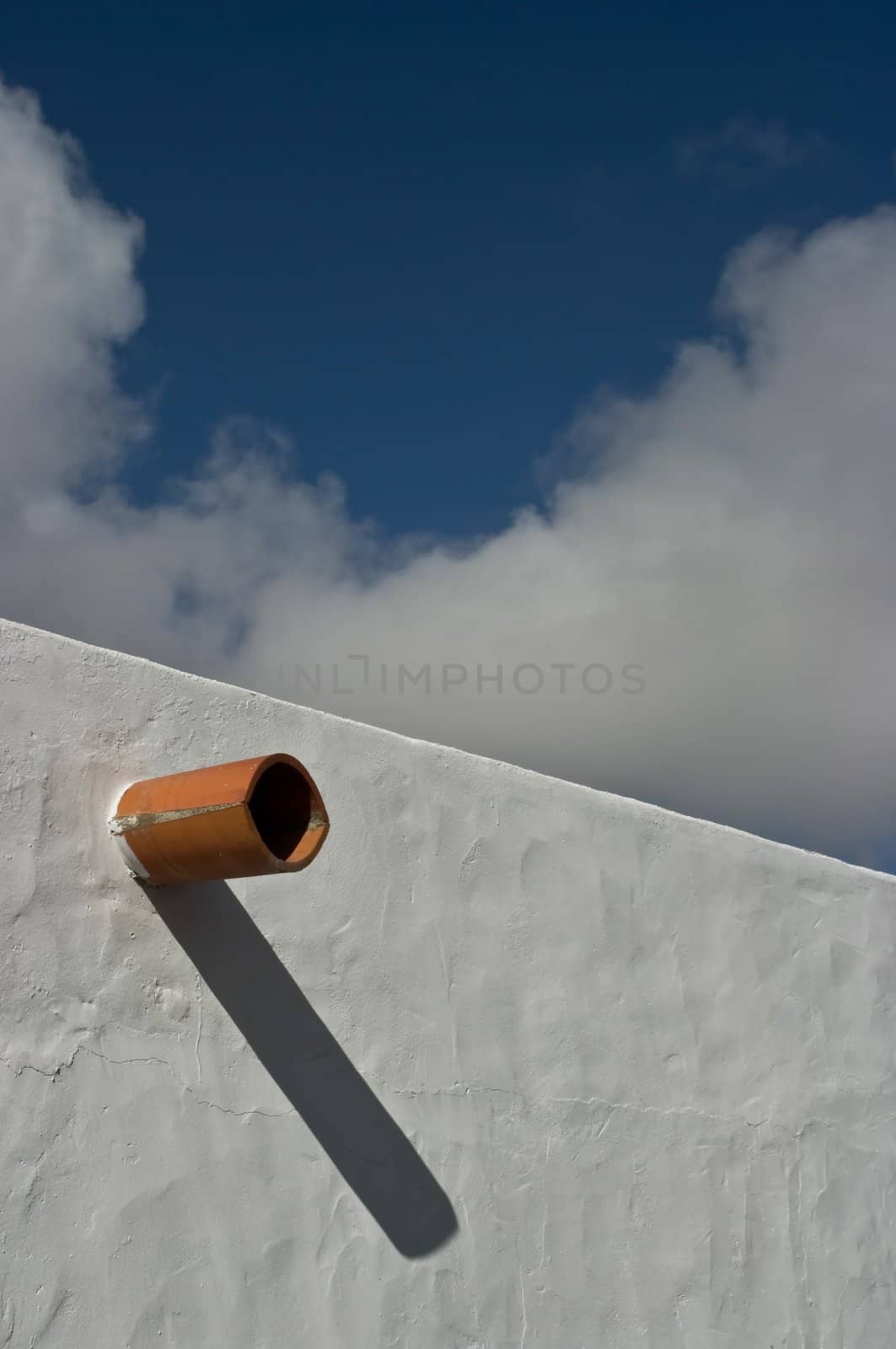 Ceramic pipe protruding from the wall, Teguise on Lanzarote Island, Spain.