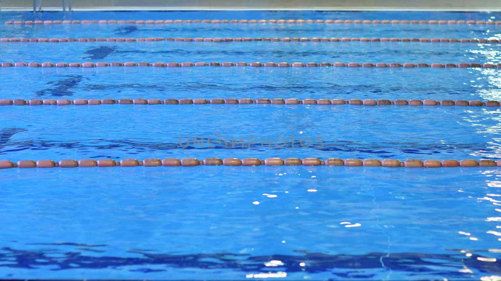 Swimming pool with blue water useful as background