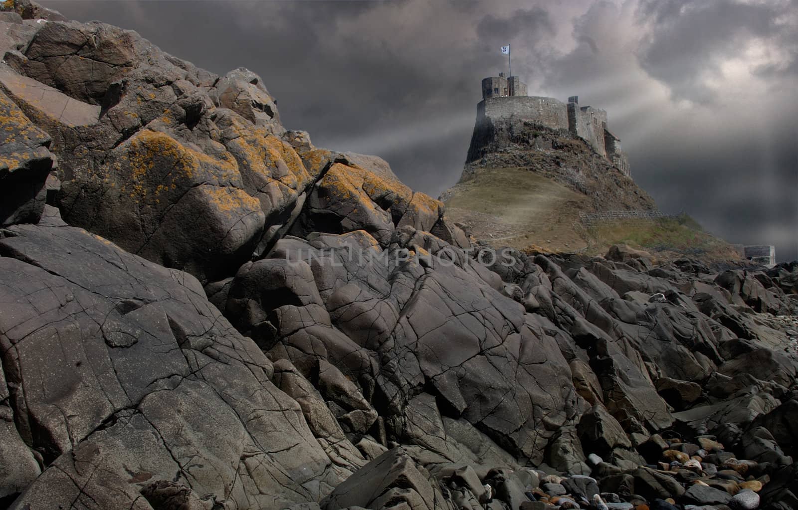 Storm clouds over Lindesfarne castle on Holy Island in Nortumberland, England.