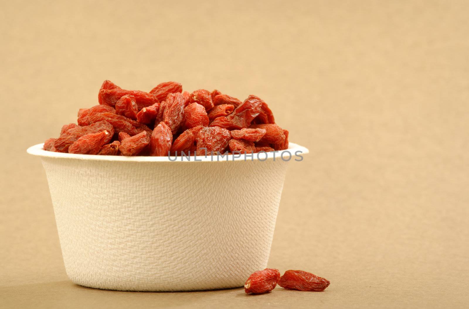 Organic Goji berries in a recyclable cup.