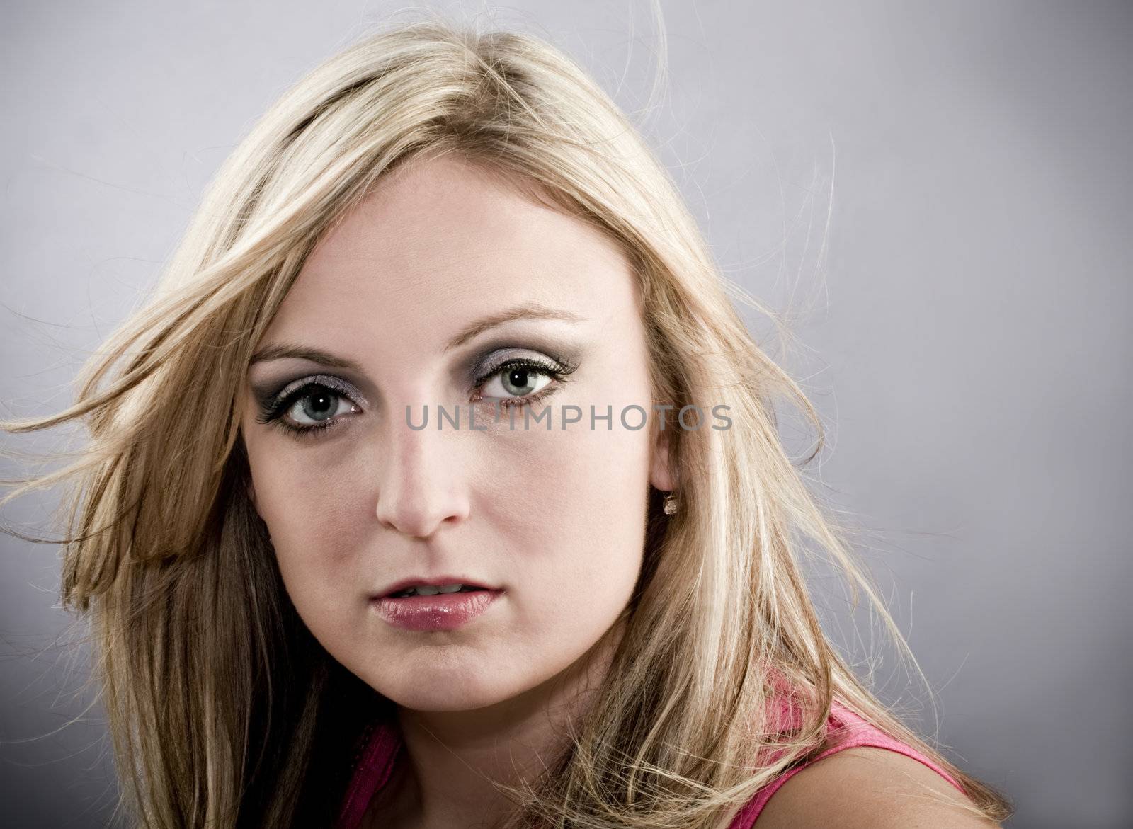 Great looking female model with hair blowing slightly and copy space.