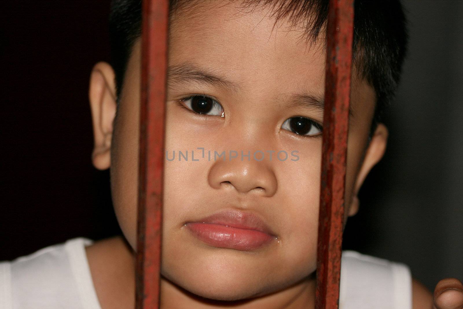 Portraiture of a young boy asian with iron bar concept
