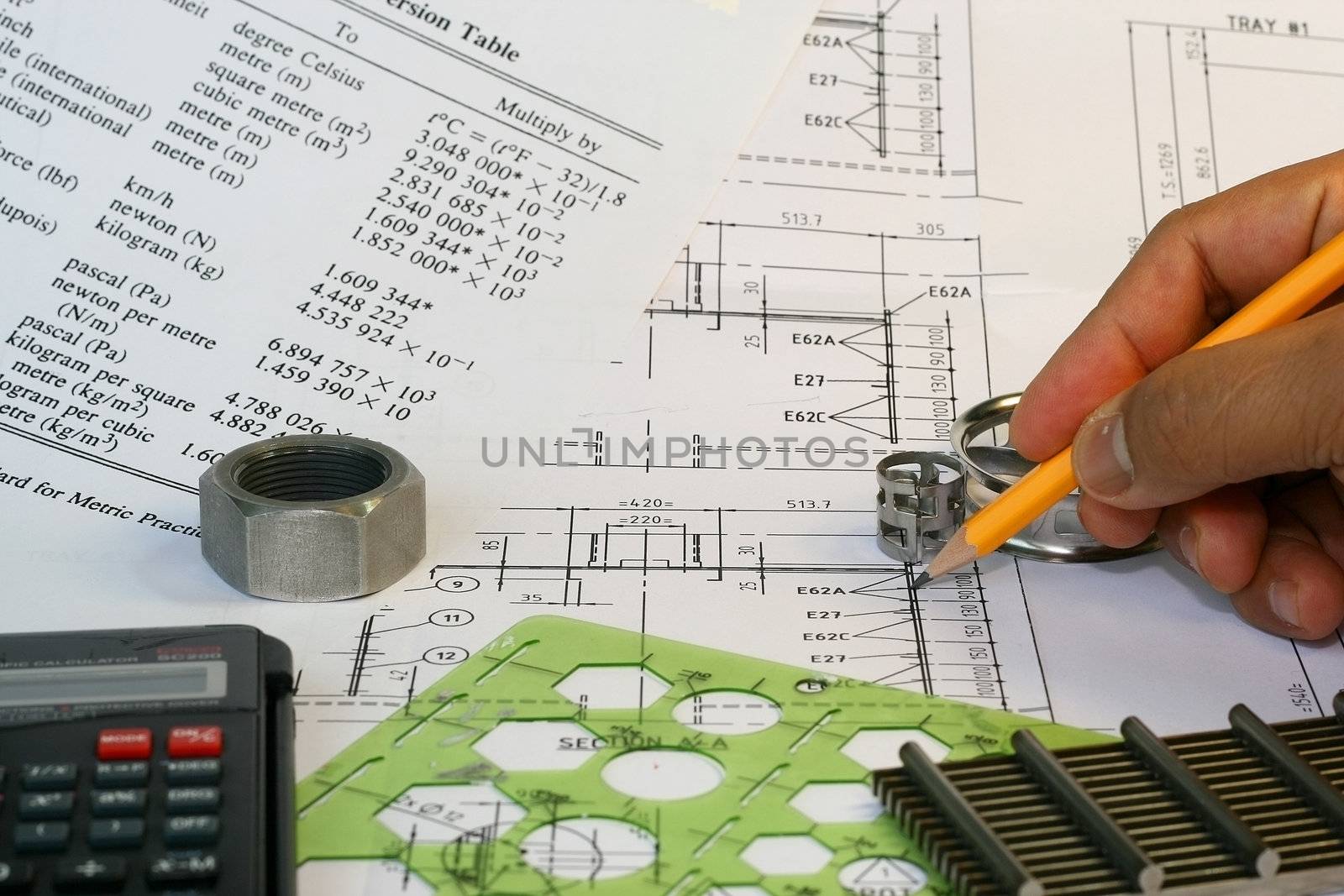 Mechanical Engineer drafting works with parts and formulas