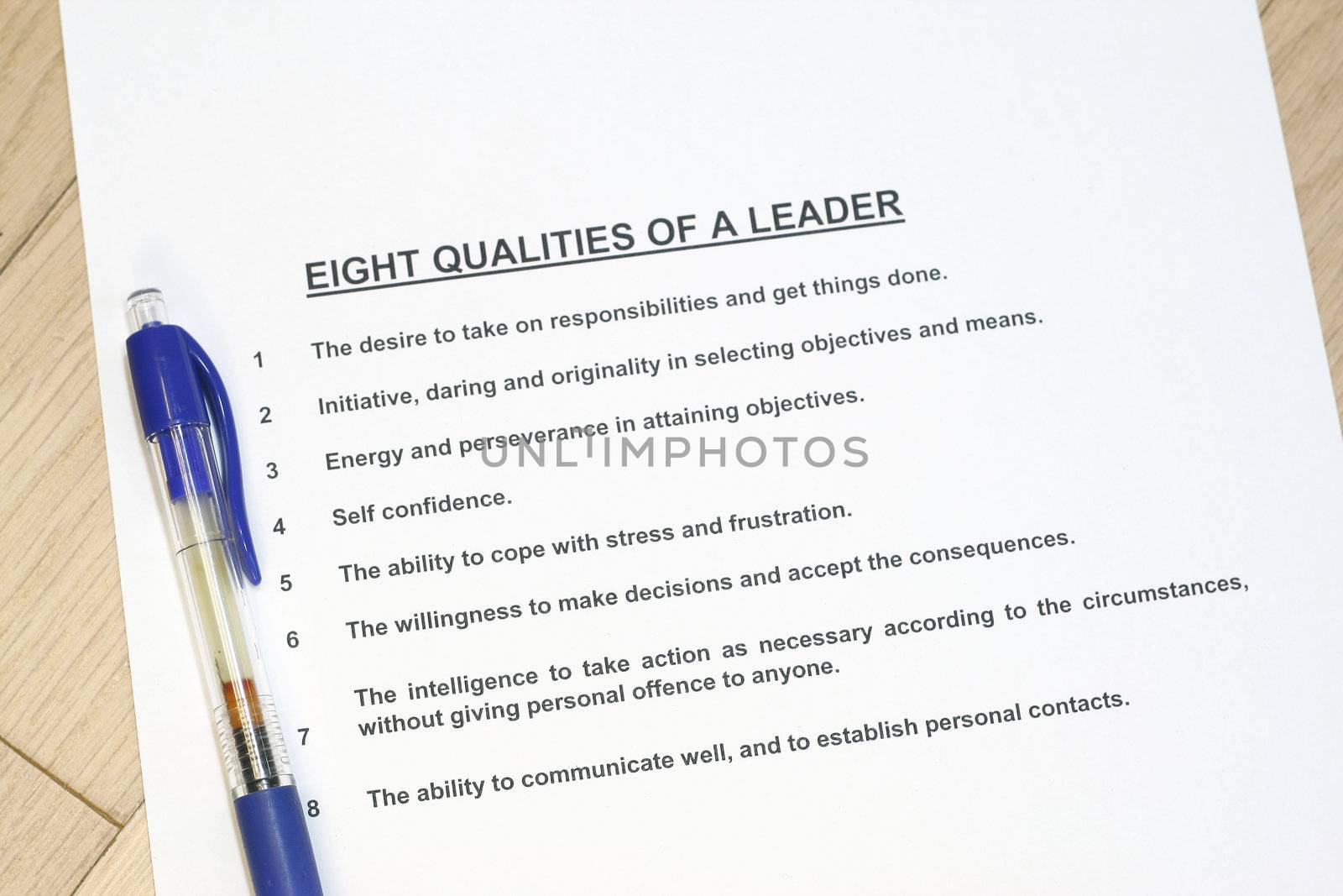 Eight qualities of a leader concept listed with a pen