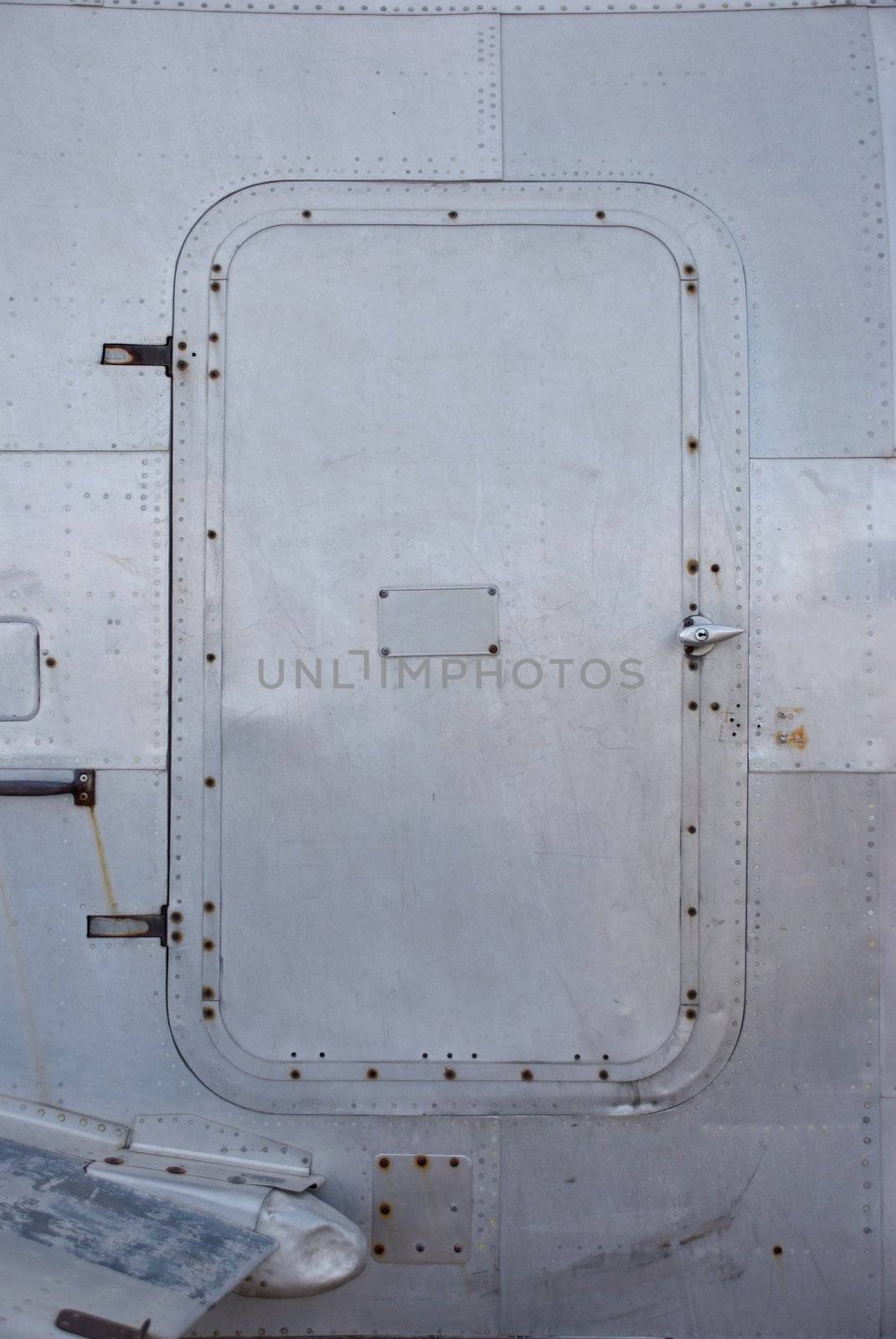 Metal Door on World War II Airplane by pixelsnap