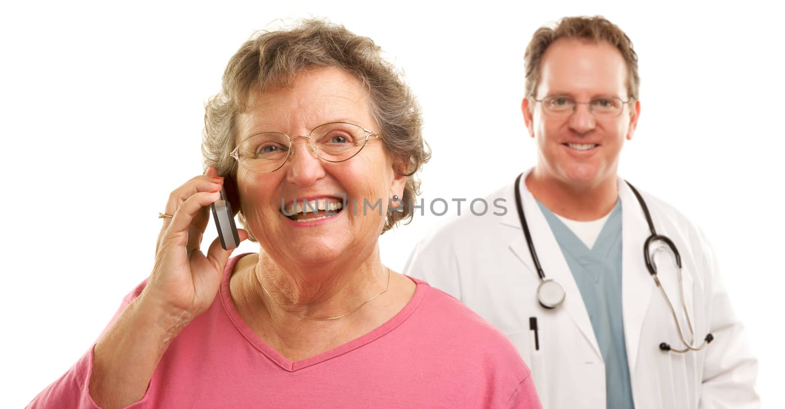 Happy Senior Woman Using Cell Phone with Male Doctor or Nurse Behind Isolated on a White Background.