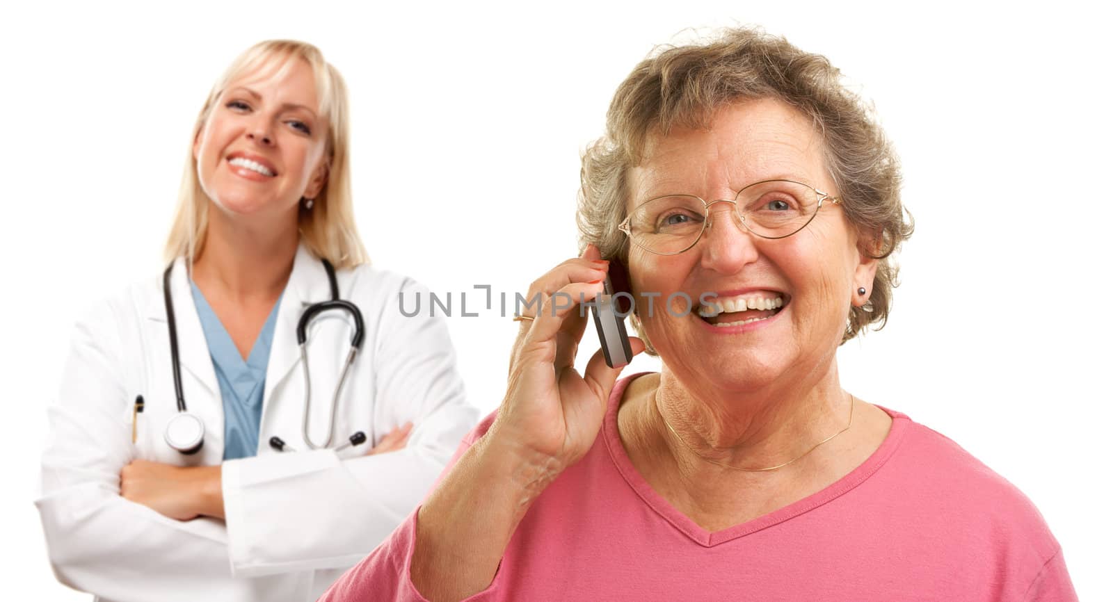 Happy Senior Woman Using Cell Phone with Female Doctor or Nurse Behind Isolated on a White Background..