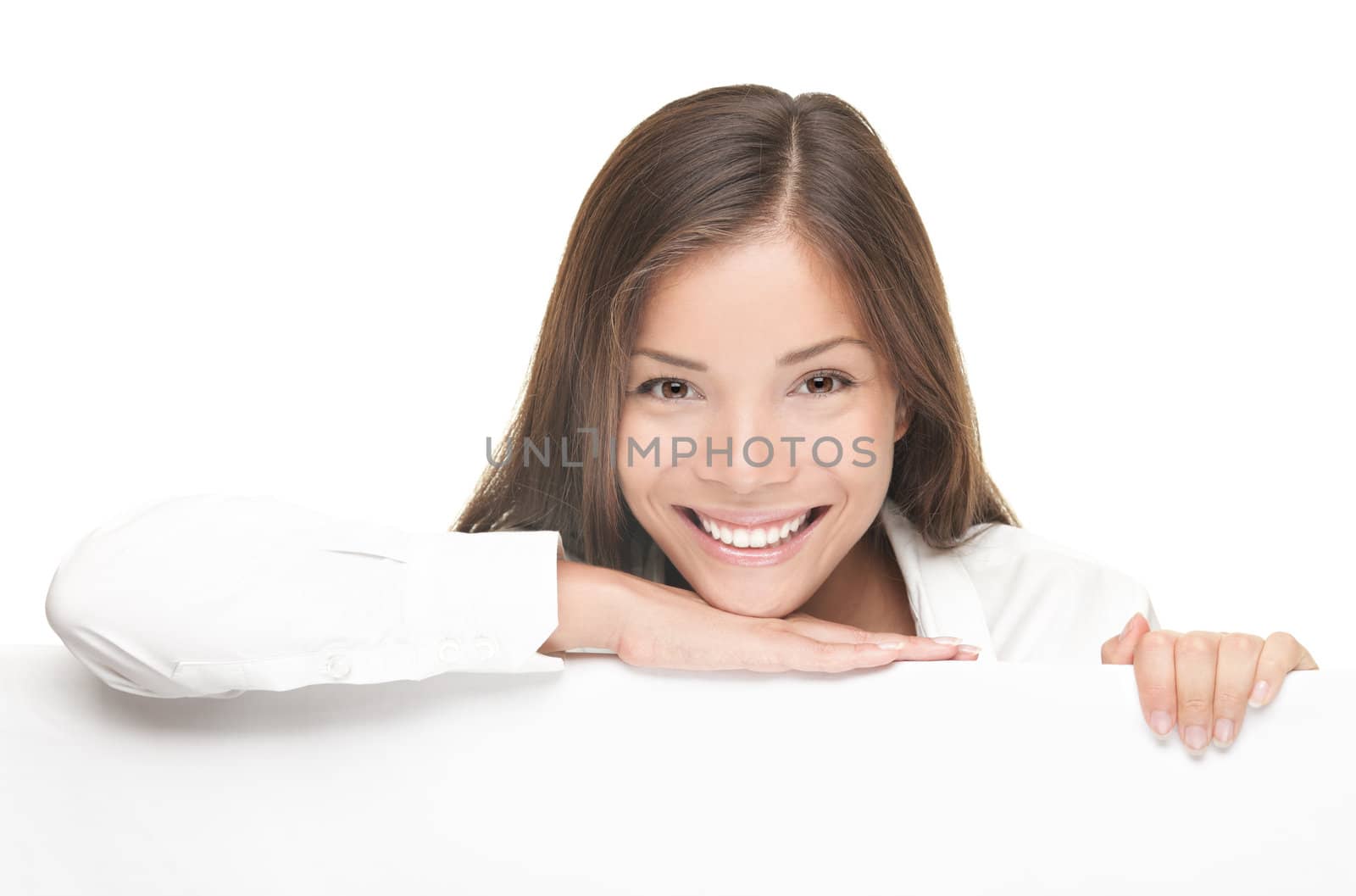 Woman billboard sign. Young beautiful woman smiling showing blank white placard.  Casual and relaxed pose by young Asian / Caucasian female model with friendly smile. Isolated on white background 