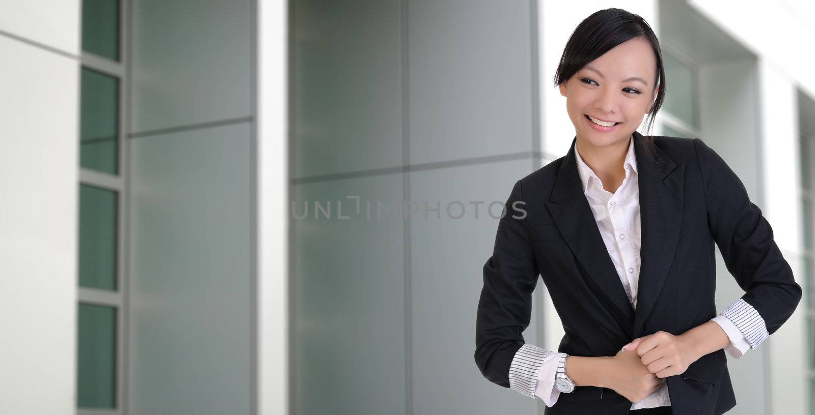 Asian lady with joy, closeup portrait outside of office.
