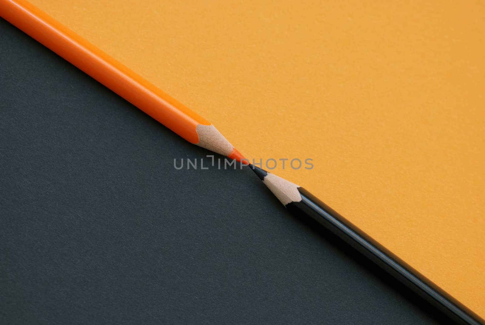 Two colored pencils diagonally