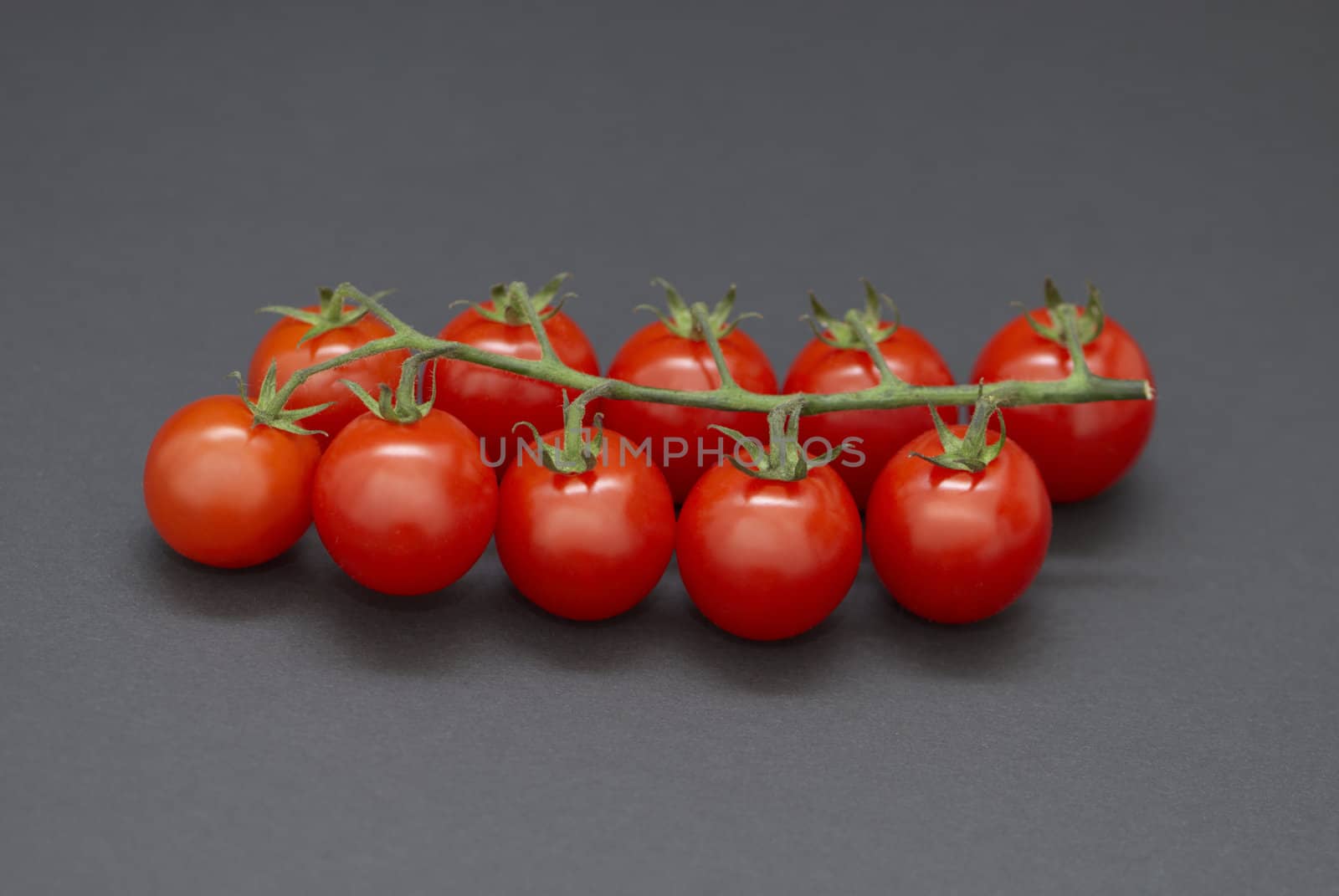 Cherry tomatoes on a black background