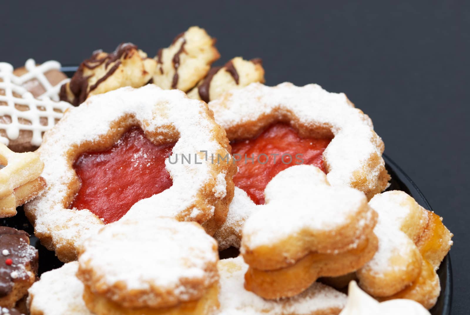 Different Christmas cakes with chocolate, cookie and sugar