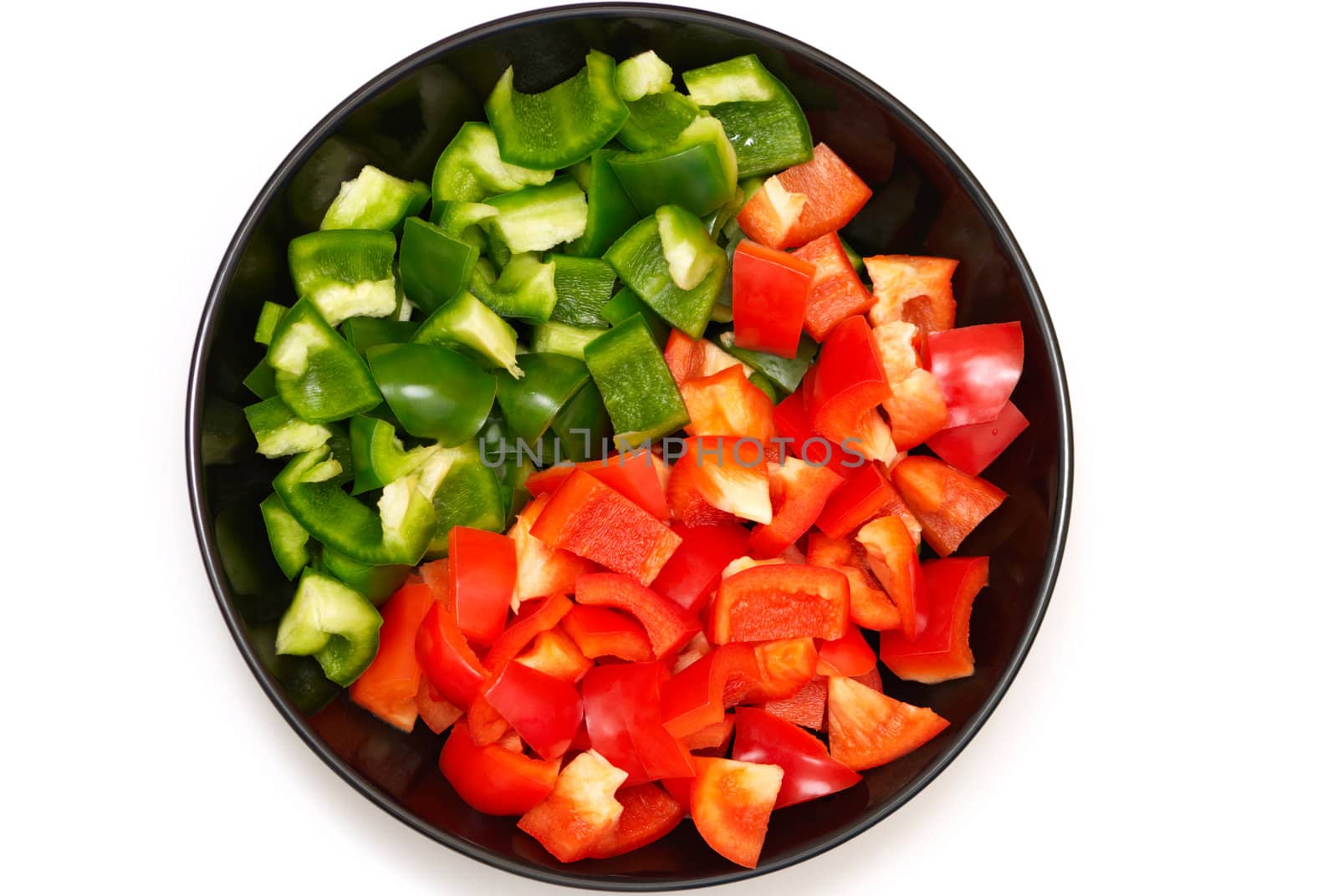 Variation of red and green peppers on a plate