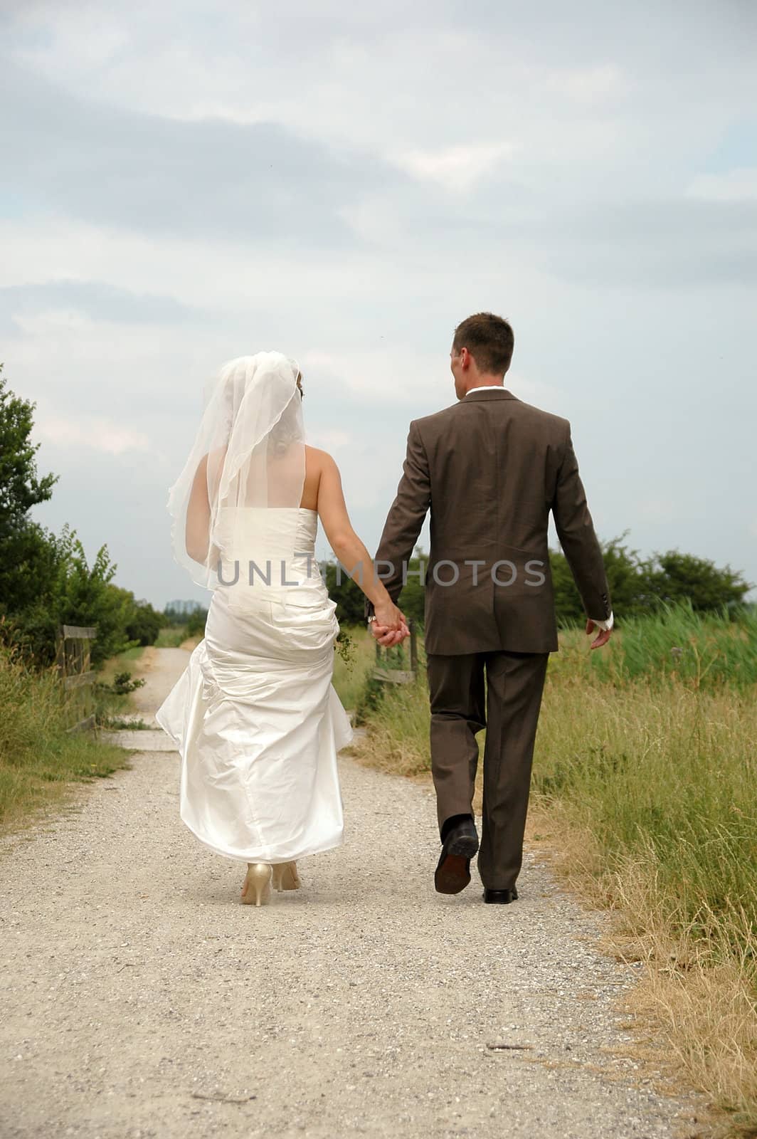 Wedding couple walking away. 