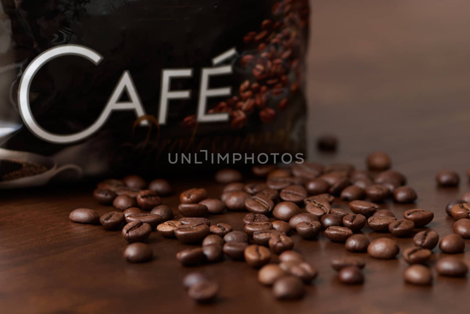 Coffee beans on a brown wooden table