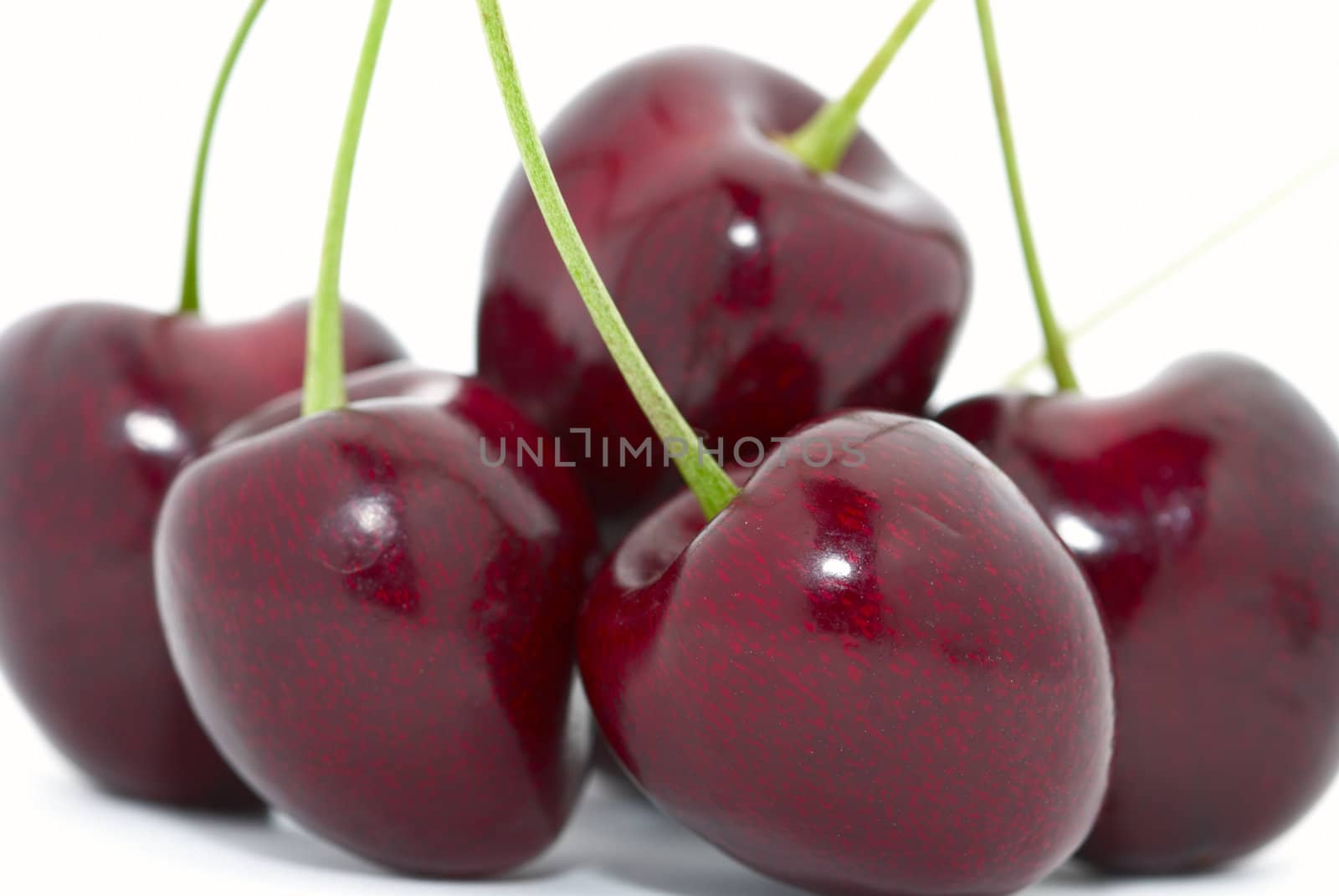 Cherries closeup isolated on white