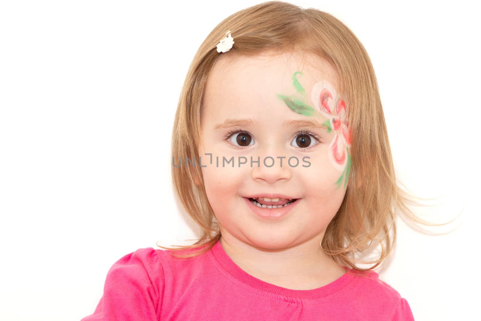 Smiling little girl with face-art isolated on white