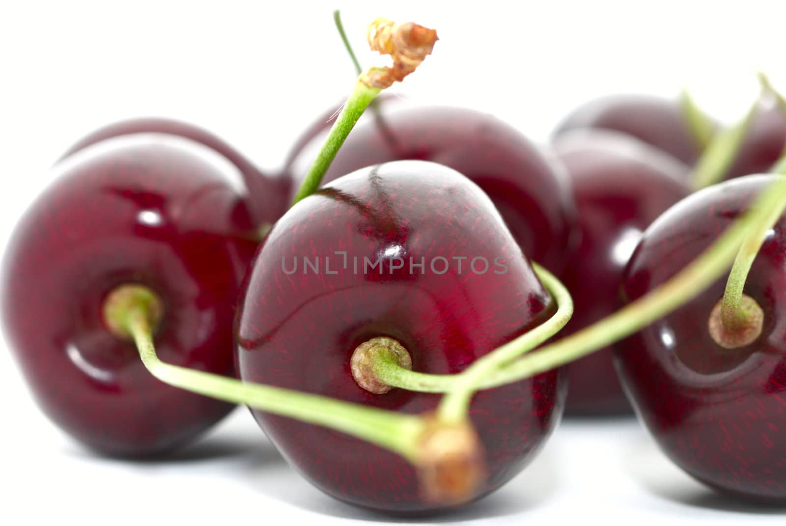 Cherries closeup isolated on white